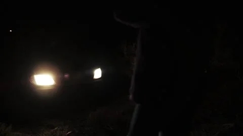 car-stuck-muddy-road-night-footage-118106233_iconl